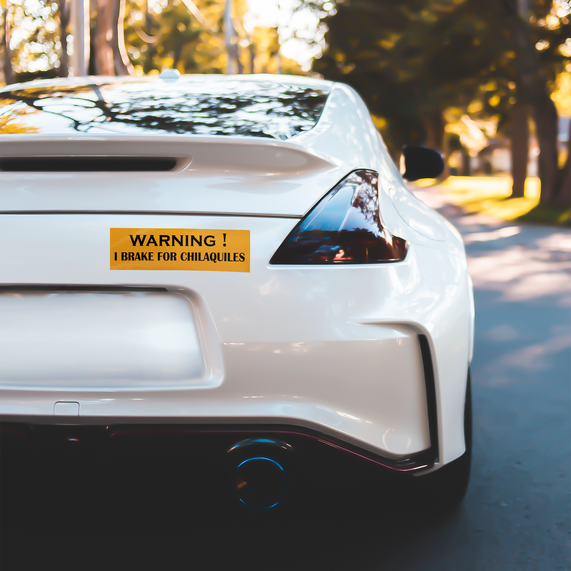 I_BRAKE_FOR_CHILAQUILES_-_Vinyl_bumper_WhiteBumperSticker-White-Car_Mockup.png