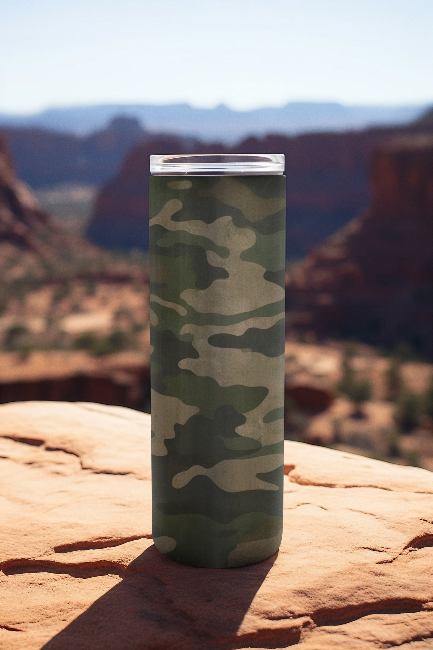 This Green Camo Skinny Tumbler features a classic style. The double-wall insulation keeps drinks hot up to 12 hours and cold up to 24 hours. The vibrant colors and sleek design make this tumbler a stylish accessory for any occasion.